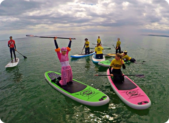 With costumes Bournemouth Surf School
