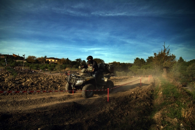 Man wearing black helmet doing quads