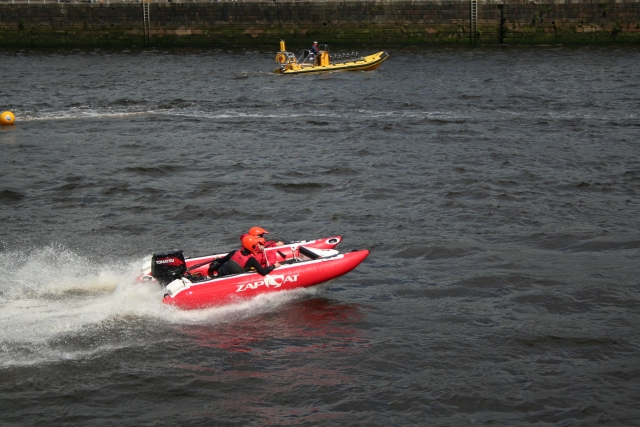 People wearing red buoyancy aids during their powerboat course