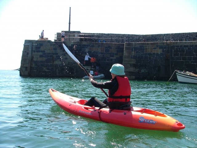 Kayaking out of Mullion Cove