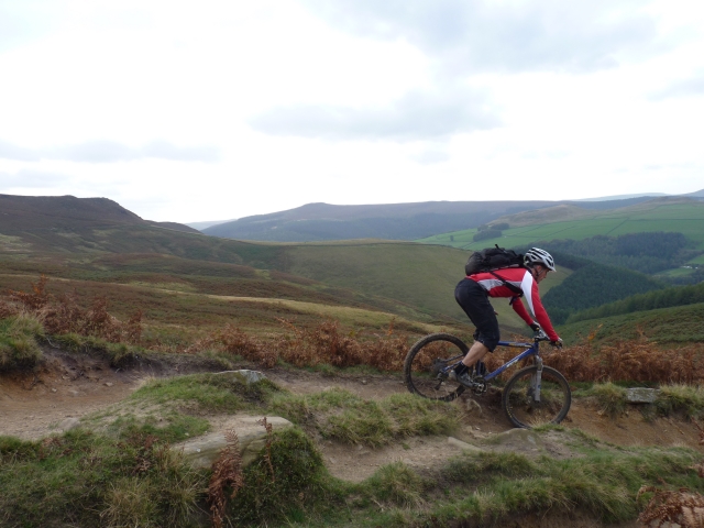 Mountain biking descending to Ladybower