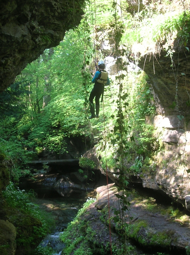 Rappelling into a canyon