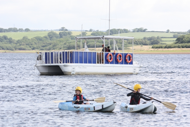 ferry with passing by kayakers