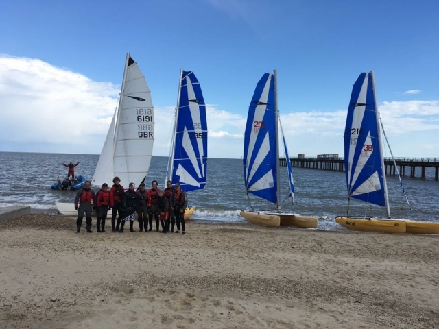 Posing with the sailboats in the background