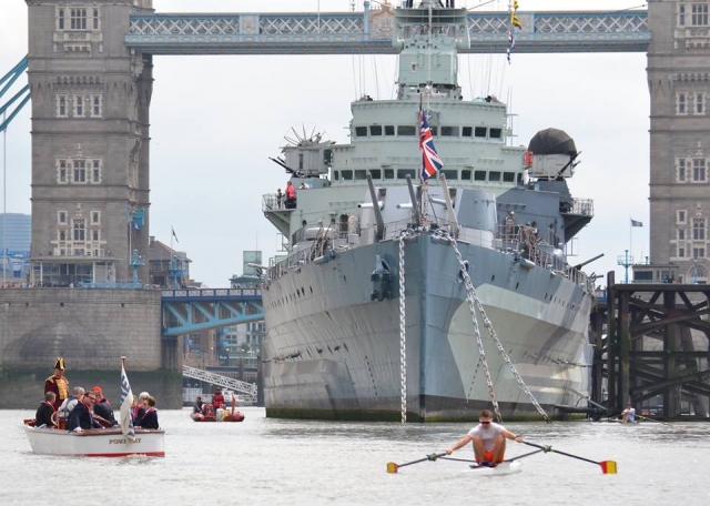 Sports boat and medium vessel through the London Tower