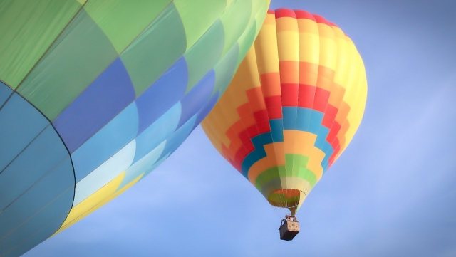 Colourful balloons flying over Wiltshire