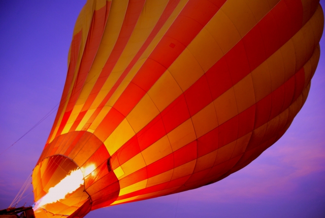 Orange and red balloon flying over the sky