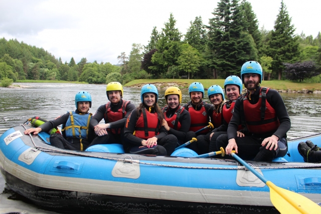 e-19759601-group-of-friends-wearing-blue-and-yellow-helmets-and-red-buoyancy-aids-getting-ready-to-enjoy-rafting16433727421597.jpg