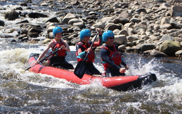 e-19759601-three-people-wearing-blue-helmets-and-red-buoyancy-aids-rafting1643372741990.jpg