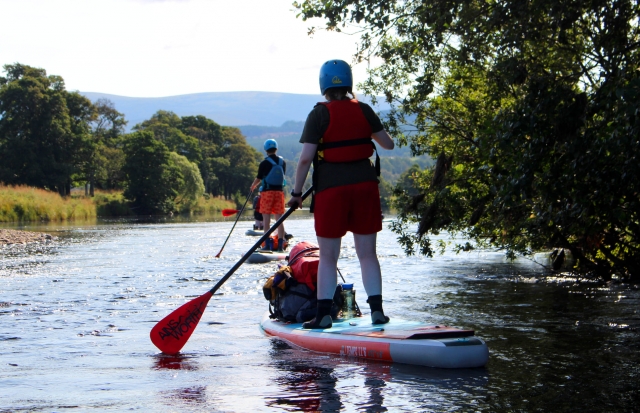 e-19759611-a-girl-and-a-boy-wearing-blue-helmet-and-red-buoyancy-aids-paddleboarding1643615390433.jpg
