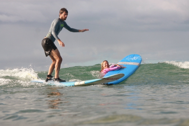 Surfing with friends in Wales