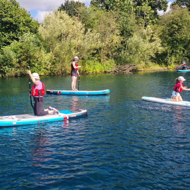 Group of children Paddle boarding