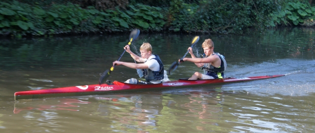 Men canoeing wearing blue t-shirts