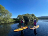Sesión de prueba grupal de SUP en Loch Insh durante 2 horas
