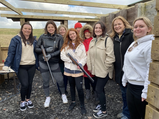 A happy group doing clay pigeon shooting