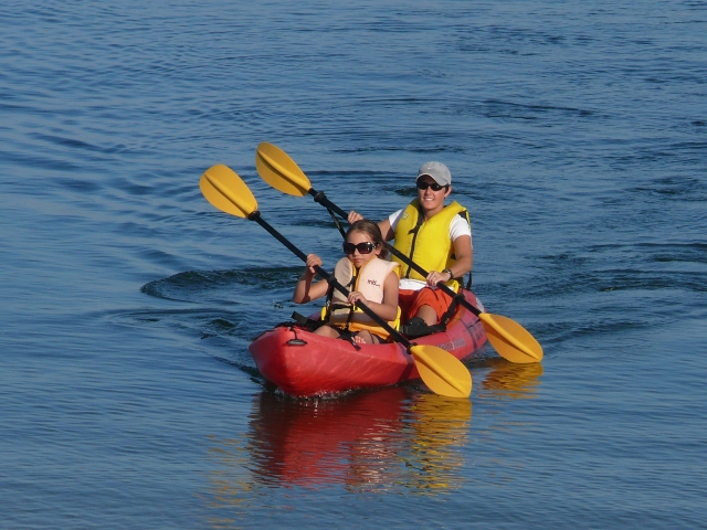Navigating the kayak around the bay