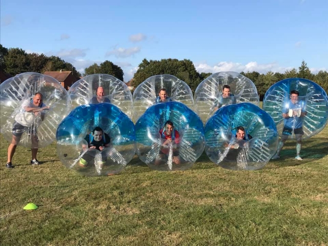 Happy participants of bubble football