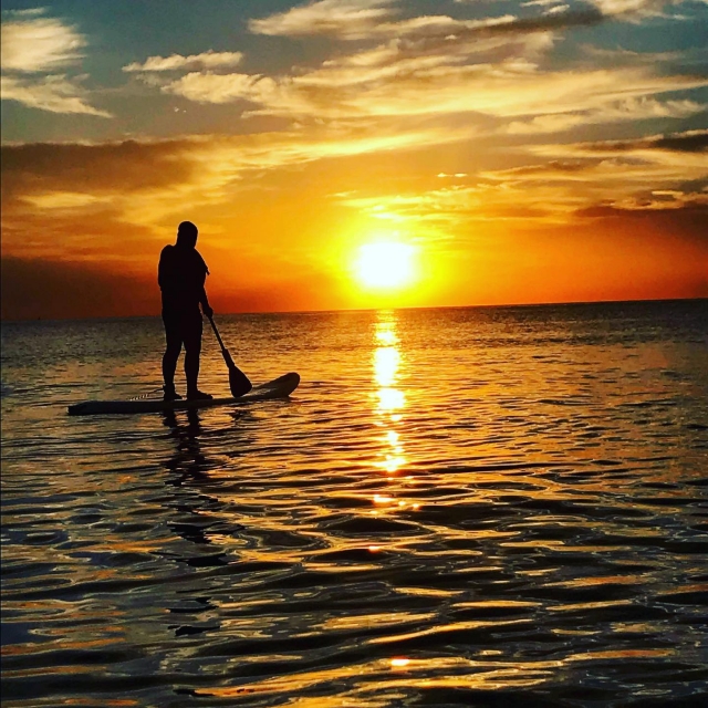 Sunrise on the paddle surf board 