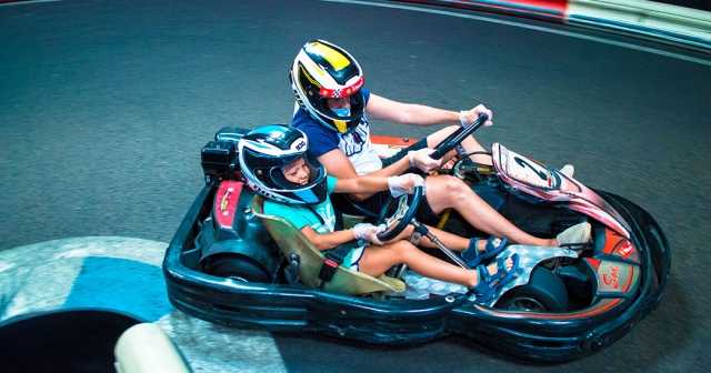 A father and his son enjoying a day of karting 